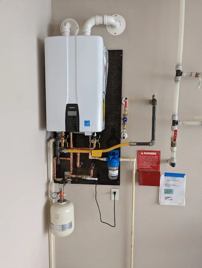 Professional plumber installing copper piping in a Socastee home